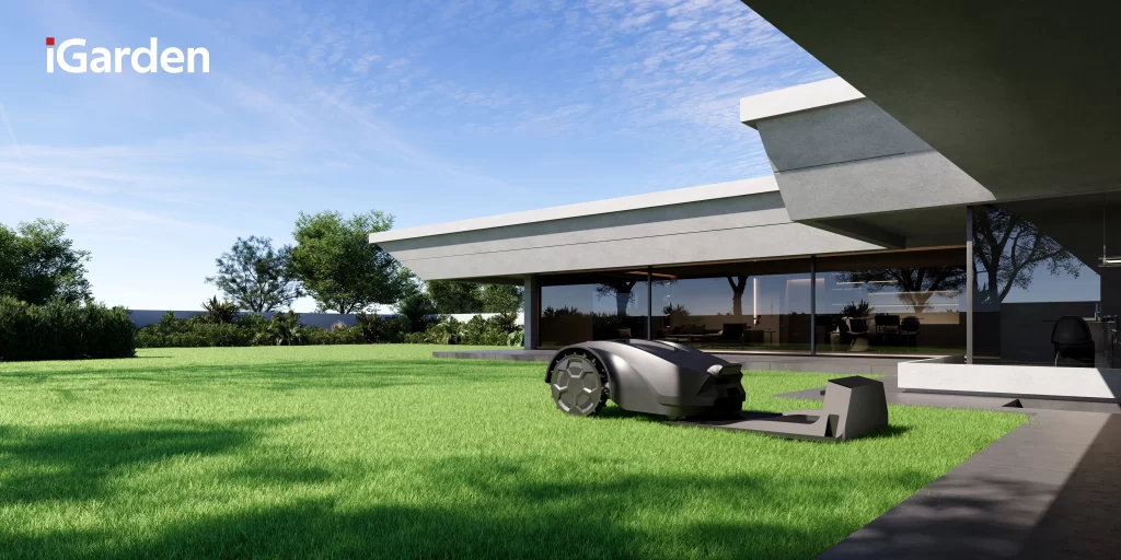 iGarden robot kosilica u radu ispred moderne kuće – autonomno košenje trave